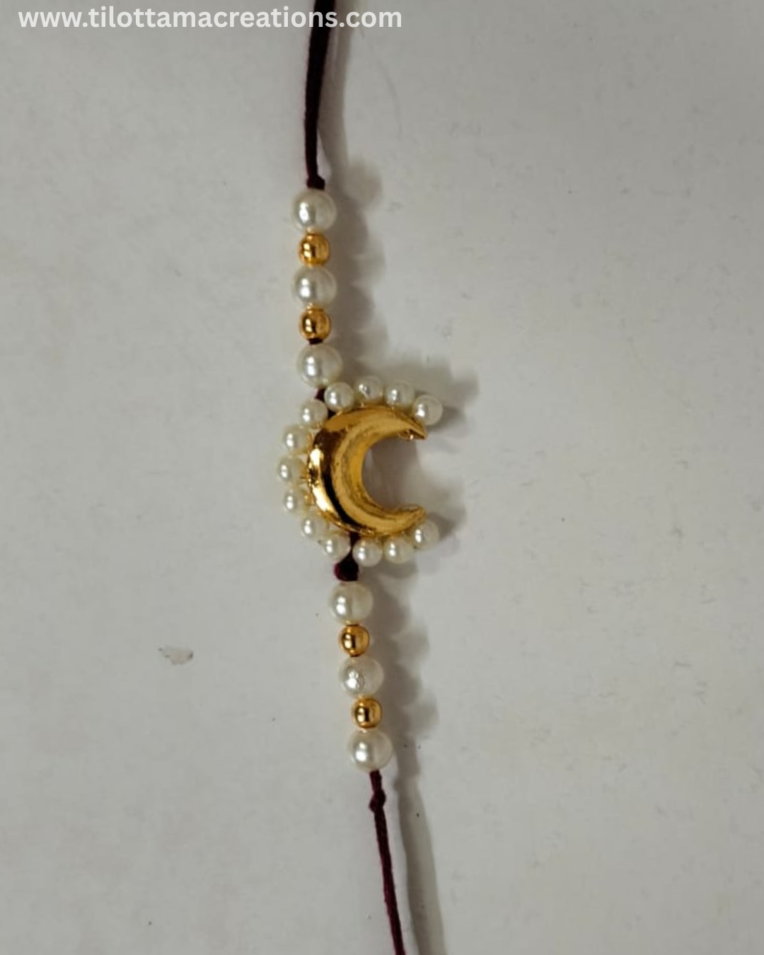 Chandrika Pearl Crescent Rakhi