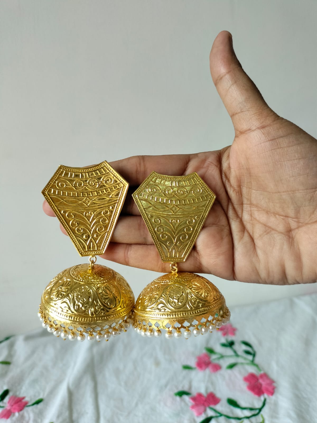 Oversized Gold-Plated Jhumkas with Geometric Shield Studs and Pearl Fringes