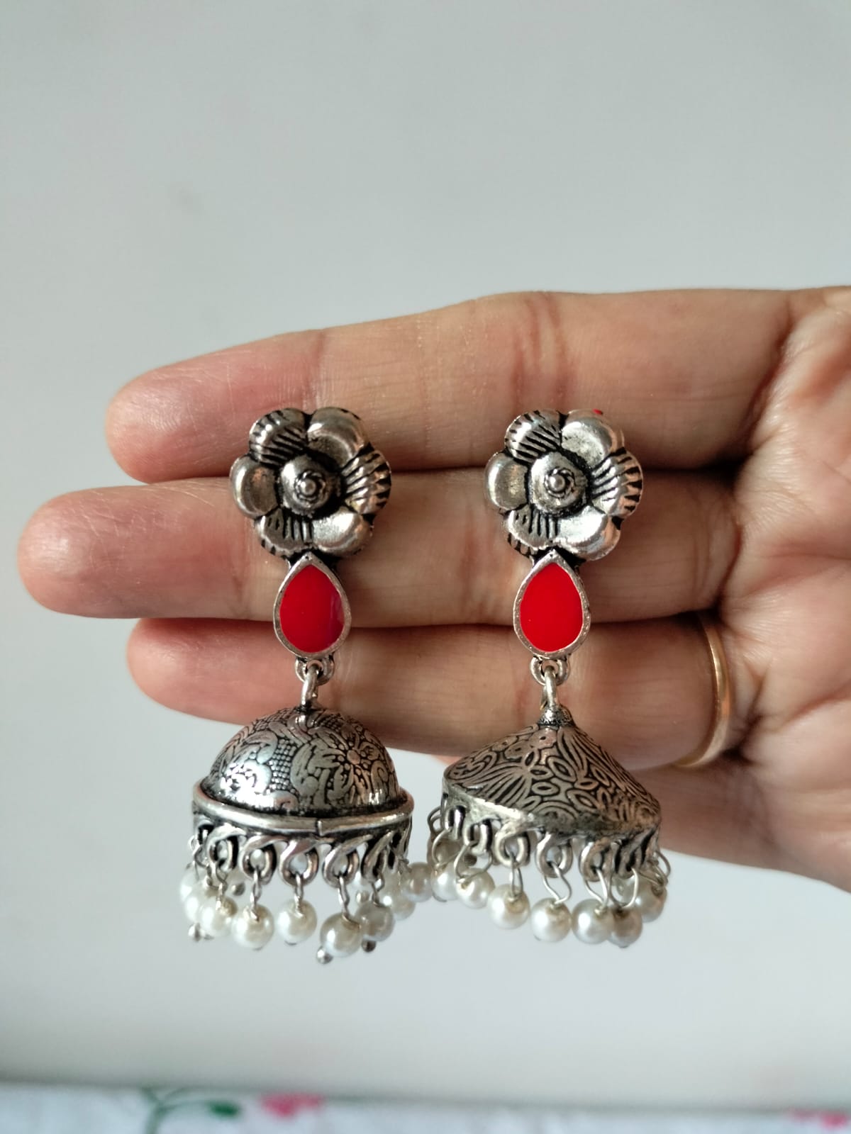 Oxidized Silver Floral Jhumkas with Red Teardrop