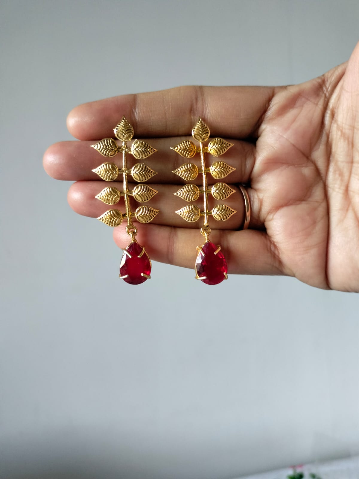 Gold-Plated Foliage Earrings with Red Crystal Drop
